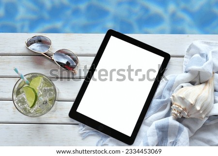 Summer vacation beach read on tablet or e-reader book cover blank screen mock up.