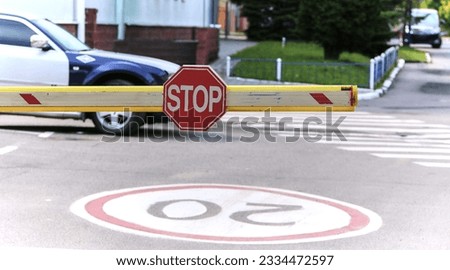 Parking space in the building with automatic barrier and stop sign. Customs, crossing the border by car.