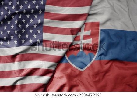 big waving colorful flag of united states of america and national flag of slovakia . macro