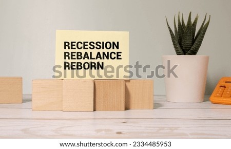 Wooden blocks with words 'Recession Rebalance Reborn'