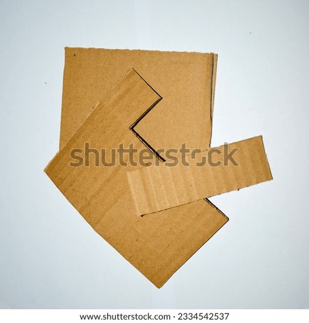 Cardboard Pieces Arranged on White Surface