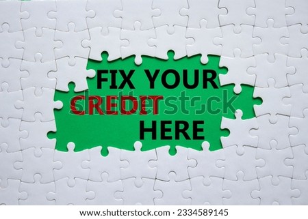 Fix your credit here symbol. Concept words Fix your credit here on white puzzle. Beautiful green background. Business and Fix your credit here concept. Copy space. Conceptual photo Royalty-Free Stock Photo #2334589145