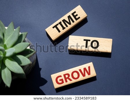 Time to Grow symbol. Concept word Time to Grow on wooden blocks. Beautiful deep blue background. Business and Time to Grow concept. Copy space. Conceptual photo