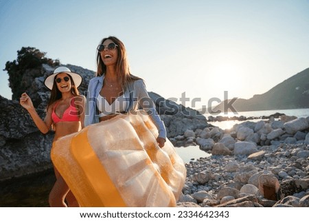 Happy young women friend having fun on the beach.