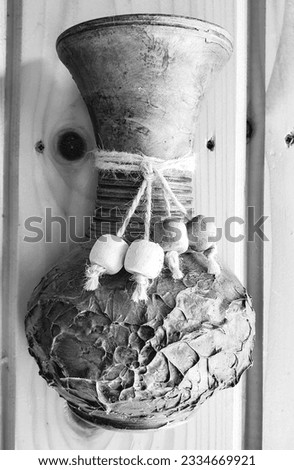 Carved wooden vases hanging on the wall, decoration ,black and white picture