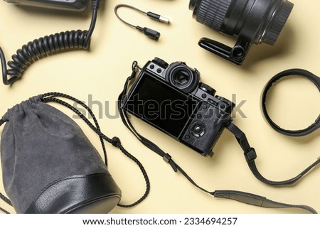Composition with modern photo equipment on color background