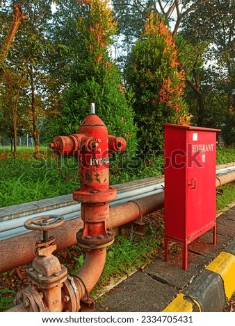 Red Water Hydrant and red box for the utilities installed in an Industrial area