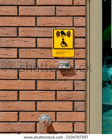 Braille sign on the brick wall 