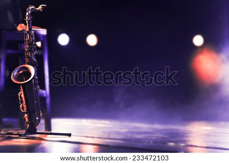 Saxophone on the stage Royalty-Free Stock Photo #233472103
