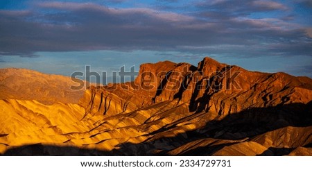 colorful sunrise in zabriskie point, death valley national park, california, usa; colorful mountains on the desert	 Royalty-Free Stock Photo #2334729731