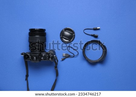 Set of professional photo equipment on color background