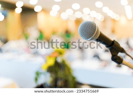 Wired microphone set up on the front of conference room close up with blurred background.  Wired microphone close up with copy space background. Royalty-Free Stock Photo #2334751669