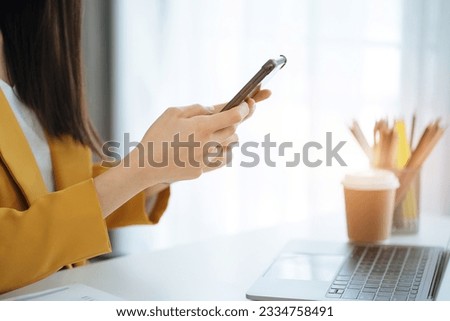 Women hand using smart phone, mobile p payments online shopping.