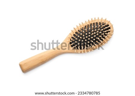New wooden hair brush isolated on white, top view Royalty-Free Stock Photo #2334780785