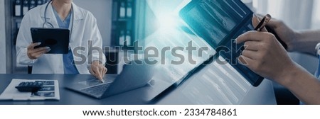 Medicine doctor working on laptop computer with a patients x-ray scans digital healthcare and connection with modern virtual screen interface icons, Medical technology and network concept. Royalty-Free Stock Photo #2334784861