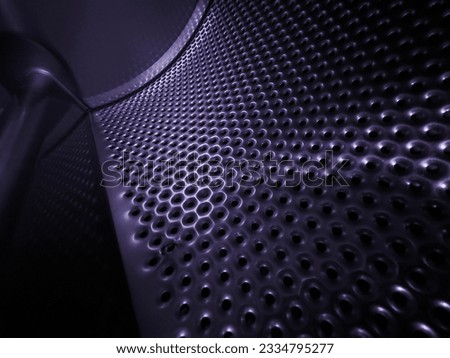 pattern holes curved metal shiny inside of dryer
