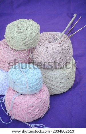 Pastel colored cotton threads with crochet hooks