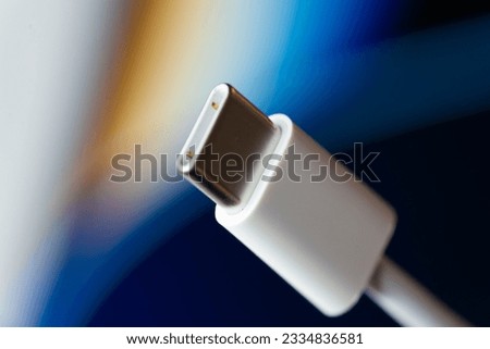 Close up of white USB-C male connector.