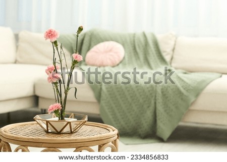 Ikebana art. Beautiful pink carnation flowers carrying cozy atmosphere at home, space for text