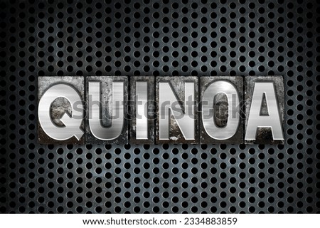 The word -Quinoa- written in vintage metal letterpress type on a black industrial grid background.