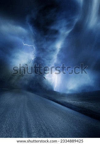 Powerful Tornado with debris on a road. Lightning illuminates the tornado.