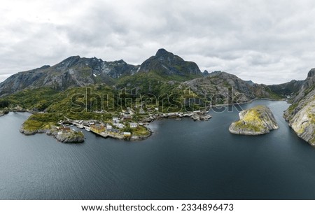 An aerial view of the rocky hills at the shore in Lofoten on a cloudy day