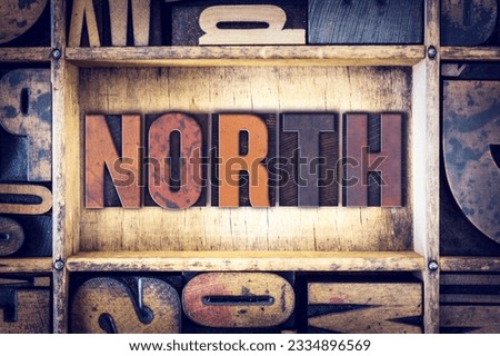 The word -North- written in vintage wooden letterpress type.