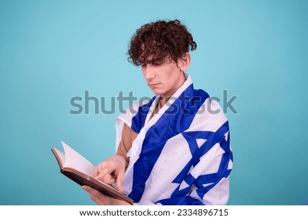 Religion and cultural heritage. A young attractive guy with a Jewish flag.