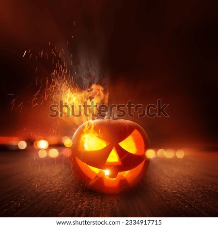 Spooky Halloween Night. A scary Jack O Lantern lit up on Halloween.