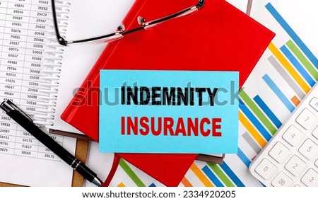 INDEMNITY INSURANCE text on sticky on red notebook on chart background Royalty-Free Stock Photo #2334920205