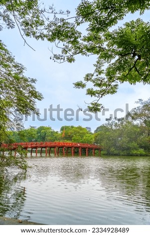 view of The Huc Red Bridge and Ngoc Son temple in the center of Hoan Kiem Lake, Ha Noi, Vietnam. Famous destination of Vietnam Royalty-Free Stock Photo #2334928489