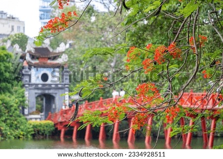 view of The Huc Red Bridge and Ngoc Son temple in the center of Hoan Kiem Lake, Ha Noi, Vietnam. Famous destination of Vietnam Royalty-Free Stock Photo #2334928511