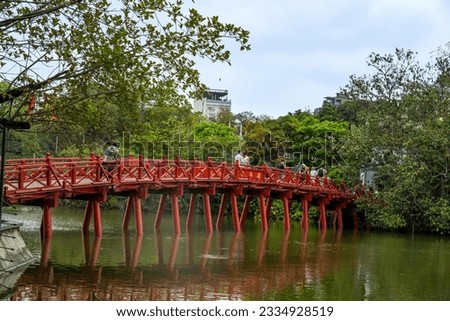 view of The Huc Red Bridge and Ngoc Son temple in the center of Hoan Kiem Lake, Ha Noi, Vietnam. Famous destination of Vietnam Royalty-Free Stock Photo #2334928519