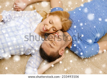 love, relations, people and family concept - happy couple lying on floor head to head at home