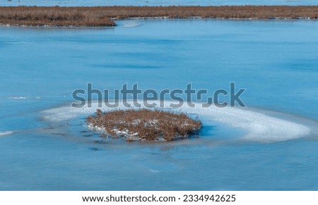 Frozen water, patterns of snow in small lakes. Tiligul estuary, Ukraine