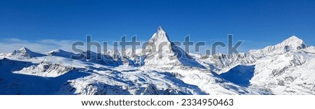 Panorama view of the Matterhorn in Zermatt, Switzerland. Panoramic alpine landscape. Royalty-Free Stock Photo #2334950463