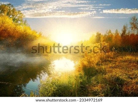 Calm river in autumn at the sunrise