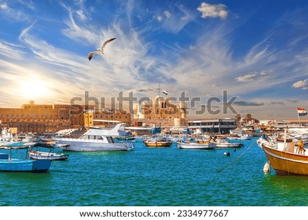 Harbour and boats in Alexandria near Qaitbay Citadel, famous view of Egypt Royalty-Free Stock Photo #2334977667