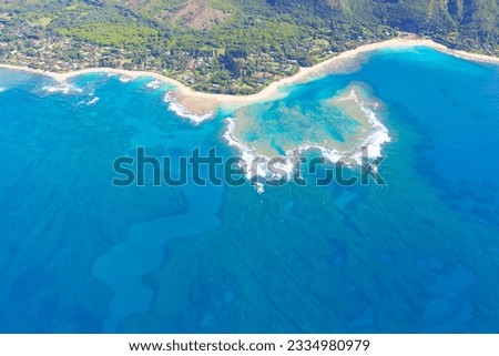 beautiful aerial view from helicopter at na pali coast and tunnels beach at kauai, hawaii