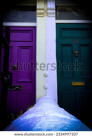 white wall splitting colourful doors