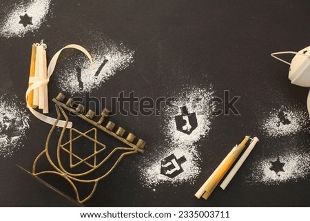 Religion image of jewish holiday Hanukkah background with menorah (traditional candelabra) with star of David and candles and יhe Hebrew letters on the spinning top (sevivon)
