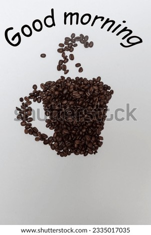 mug arranged from coffee beans, coffee cup pattern from coffee beans background from coffee beans, background with the inscription good morning with a cup from beans