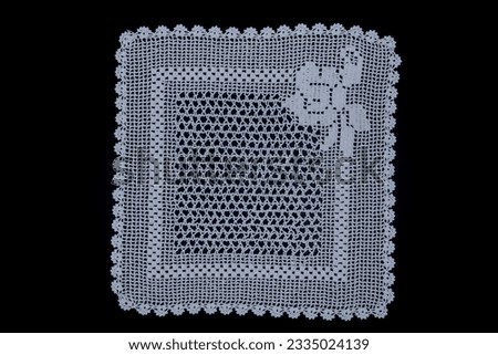 Handmade lace tablecloth, coffee table cover, towel edge. Anatolian motifs, nostalgic crochet lace detail texture. Royalty-Free Stock Photo #2335024139