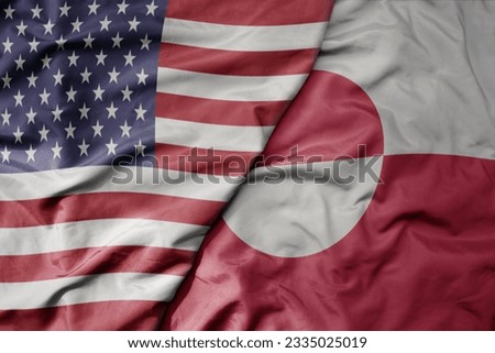 big waving colorful flag of united states of america and national flag of greenland . macro