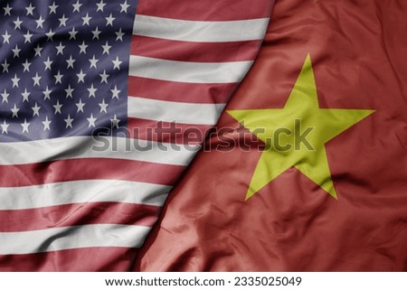 big waving colorful flag of united states of america and national flag of vietnam . macro