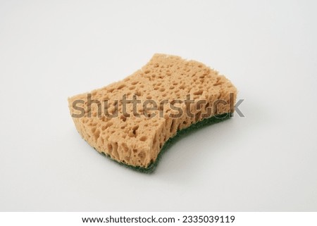 Natural sponge isolated. Green brown sponges, body care concept, eco friendly hygiene accessory, scotch brite dishwasher on a white background
