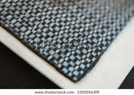 Piece of carbon fiber seen from close up