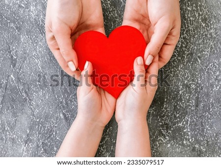 Family Love: Mother and Daughter Bonding with Heart Shape in Top View, Heartwarming Connection Royalty-Free Stock Photo #2335079517