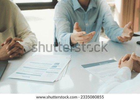 A Human Resource (HR) manager engages in an interview with a candidate, assessing their qualifications, skills, and suitability for the position. Through a comprehensive evaluation, the HR manager. Royalty-Free Stock Photo #2335080855