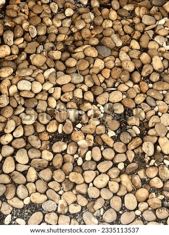a photography of a pile of rocks and gravel on a ground, there is a pile of rocks and gravel on the ground.